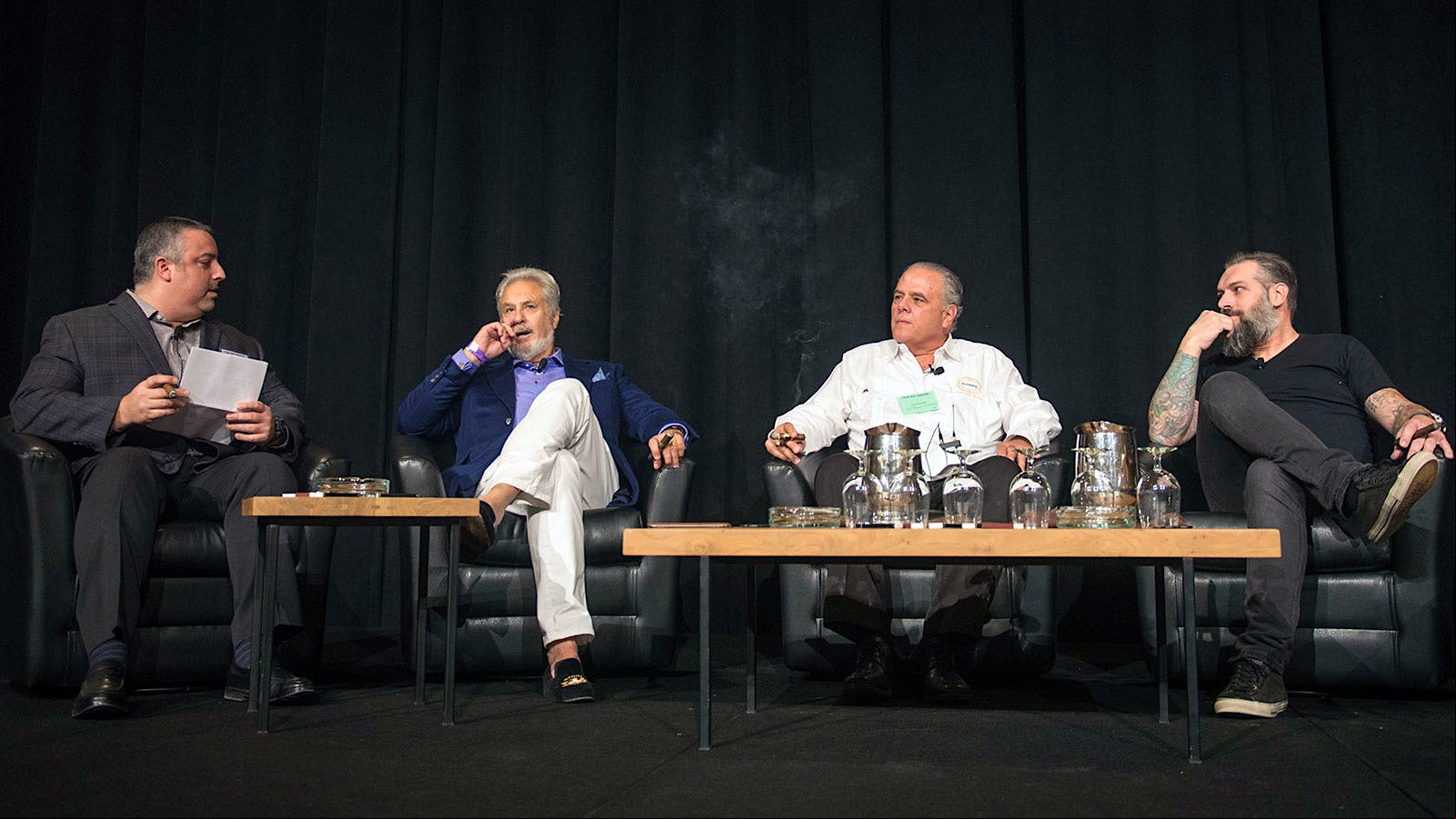Senior editor Gregory Mottola, far left, speaks with three cigarmakers for a seminar on Miami-made cigars. From left: Bill Paley, of La Palina, Paul Palmer, of Casa Fernandez, and Pete Johnson, of Tatuaje.
