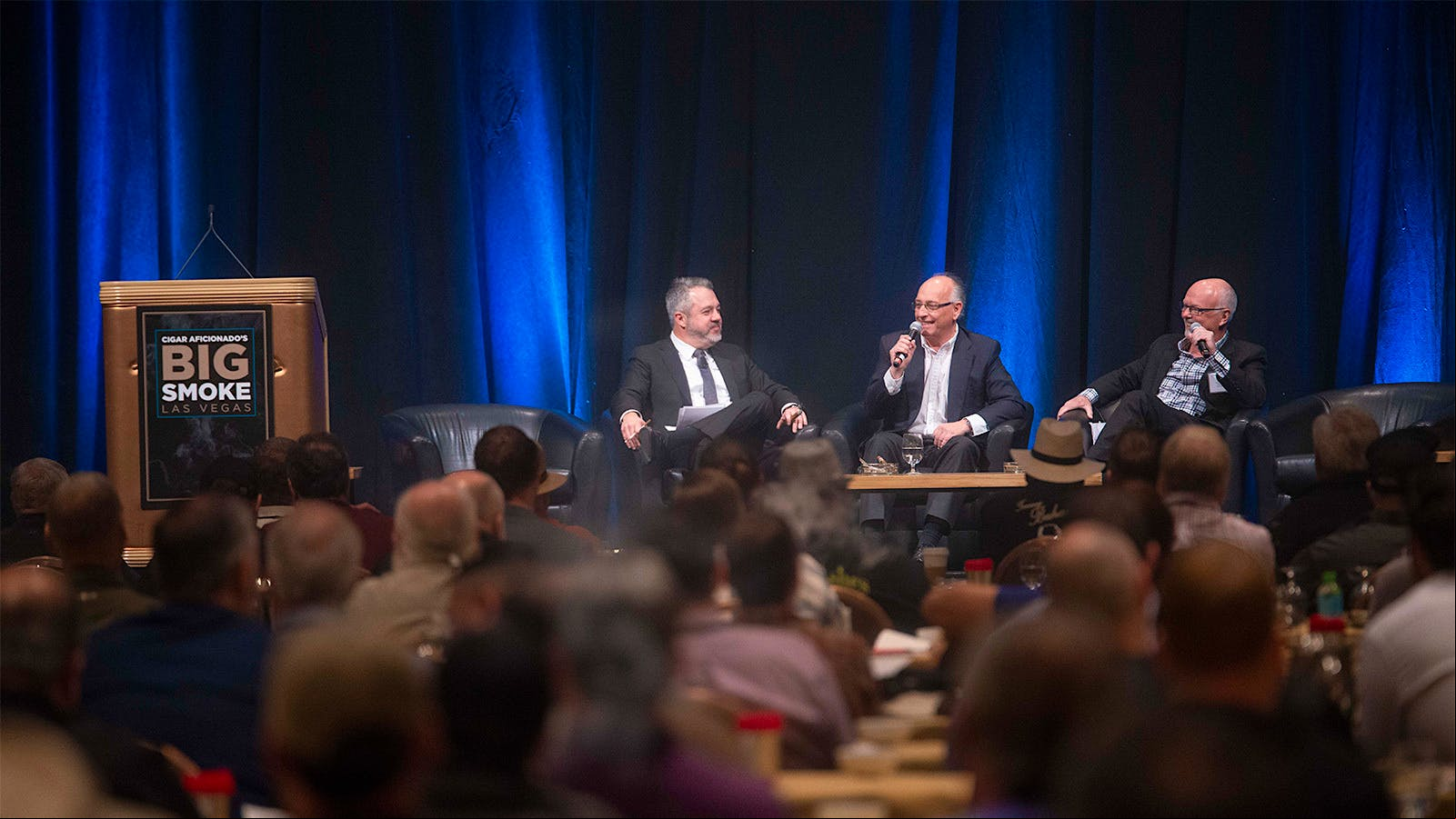 Fernando Domínguez, center, speaks with editors David Savona and Gordon Mott about Cuban cigars.