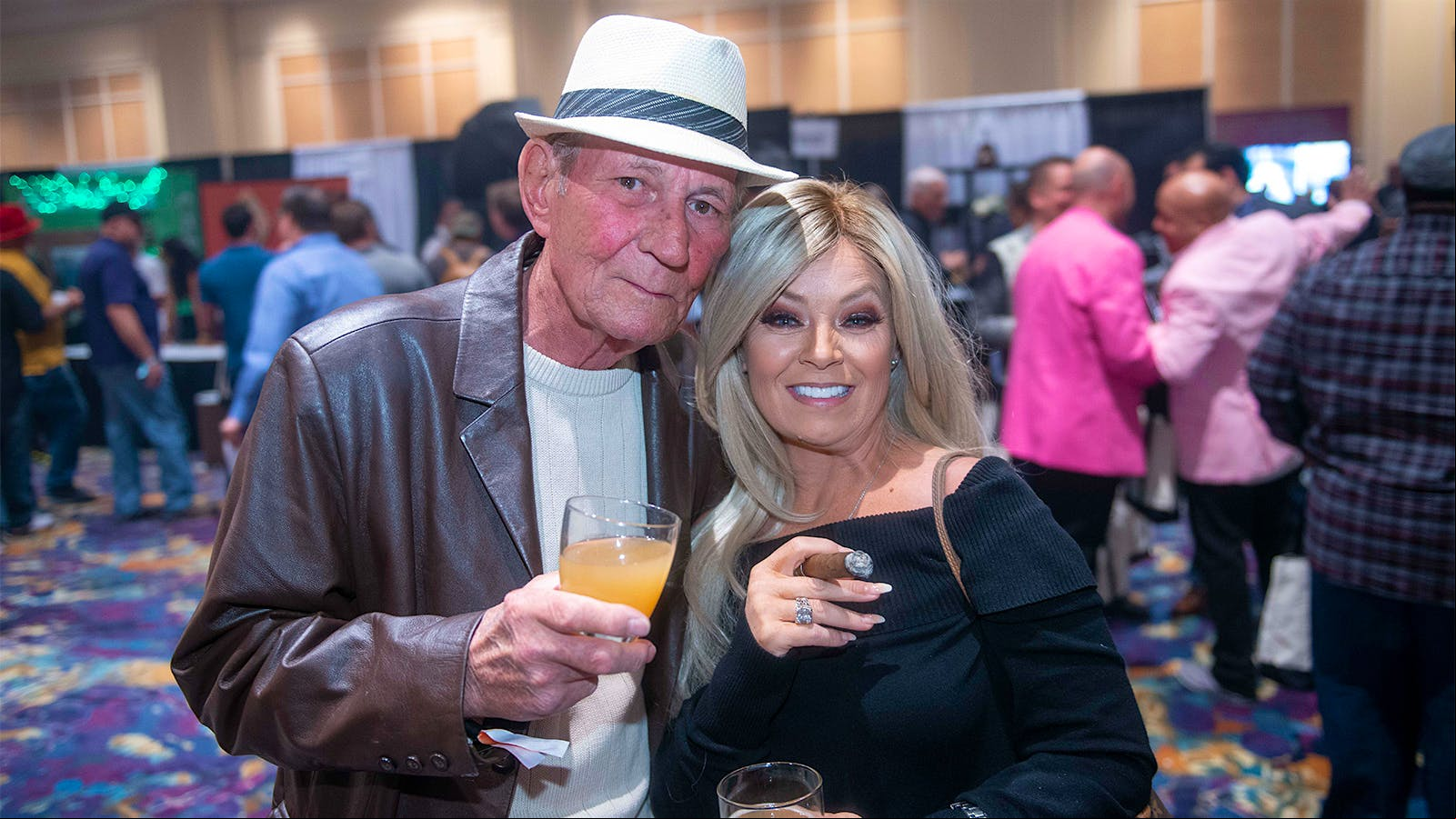Buck Bahm and Anyda Aquino enjoy fine cigars and libations.